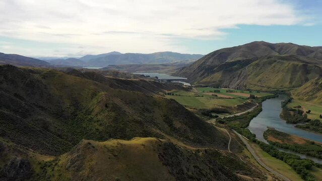 High hill range around Waitaki river valley at Kurow town &ndash; aerial panorama 4k.
