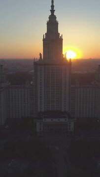 Moscow State University and City Skyline at Sunrise. Russia. Aerial View. Drone is Flying Upward. Vertical Video