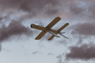 Lancet kamikaze drone on the background of the sky under the clouds, Russian drone attacks. 