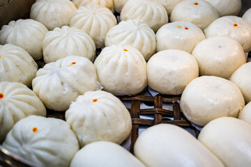 Chinese steamed buns in the steam pot displayed at the stall. Popular street food in Thailand, China, Asia
