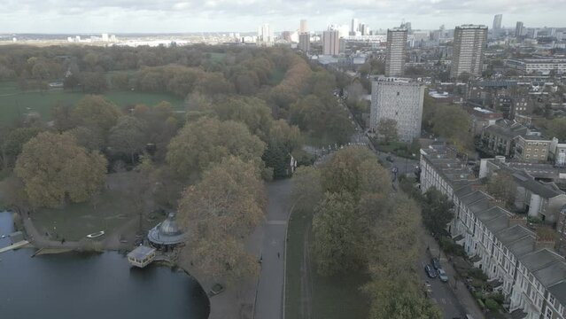 High drone shot of the West Lake in Victoria Park and the nearby buildings in East London, England