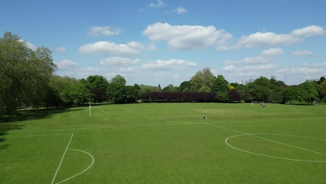 Drone footage of the Football Pitch on a sunny day in Victoria Park in East London, England