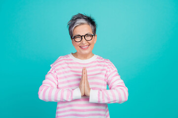 Photo of good mood positive lady wear striped sweater spectacles asking buy new clothes empty space isolated turquoise color background