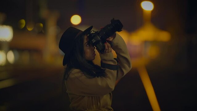 Professional Female Photographer Using DSLR Camera Capturing Photos