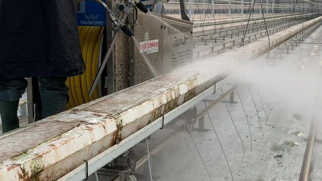 cleans with high pressure water. High quality 4k footage