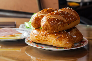 delicious freshly baked bread for breakfast on a plate on a dining table