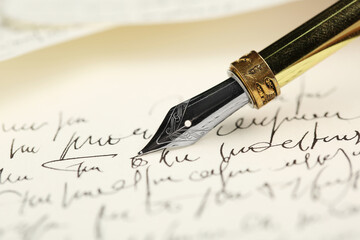 One fountain pen on handwritten letter, closeup