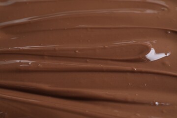 Tasty chocolate paste as background, closeup view