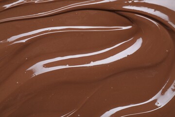 Tasty chocolate paste as background, closeup view