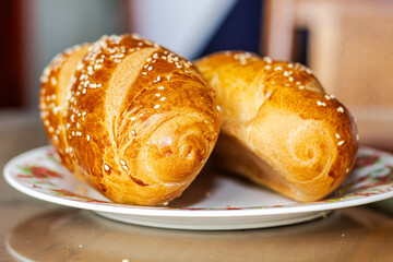 delicious freshly baked bread for breakfast on a plate on a dining table