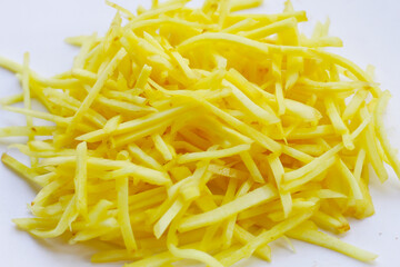 Ginger chopped on white background.