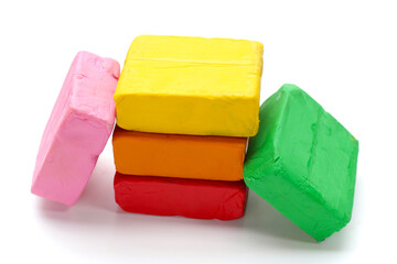 Colorful plasticine clay on white background.
