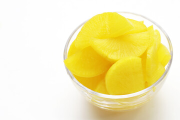 Sweet and tart slices of yellow pickled daikon, known as takuan in Japan and danmuji in Korea.