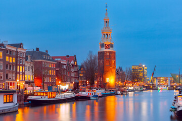 Amsterdam canal Oudeschans and tower Montelbaanstoren, Holland, Netherlands.