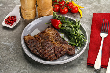 Grilled chuck roll steak with arugula