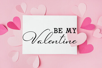 Beautiful greeting card for Valentine's Day with paper hearts on pink background