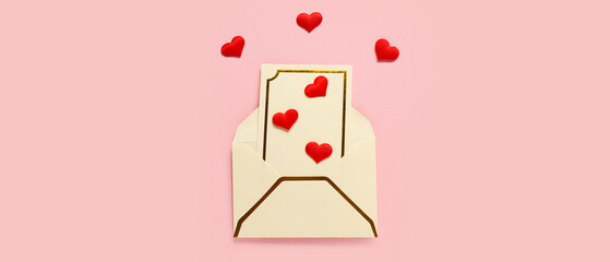 Envelope and red hearts on pink background, top view. Valentine's Day celebration
