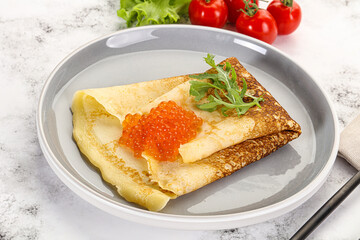 Russian pancake with red caviar