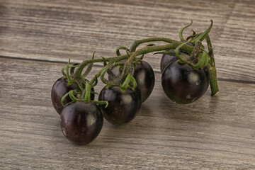 Ripe tasty black cherry tomato