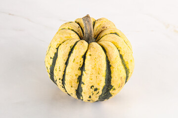 Ripe raw fresh decorative pumpkin