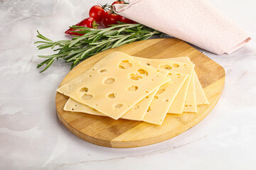 Sliced maasdam cheese with holes
