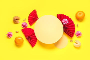 Blank cards with Chinese symbols, tangerines and fortune cookies on yellow background. New Year...