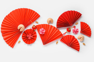 Chinese symbols with fortune cookies and flowers on white background. New Year celebration