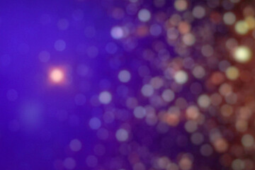 Abstract glitter bokeh lights in purple blur background. Defocused circular image.