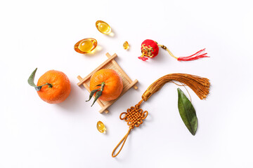 Composition with tangerines, lucky talisman and Chinese symbols on white background. New Year...