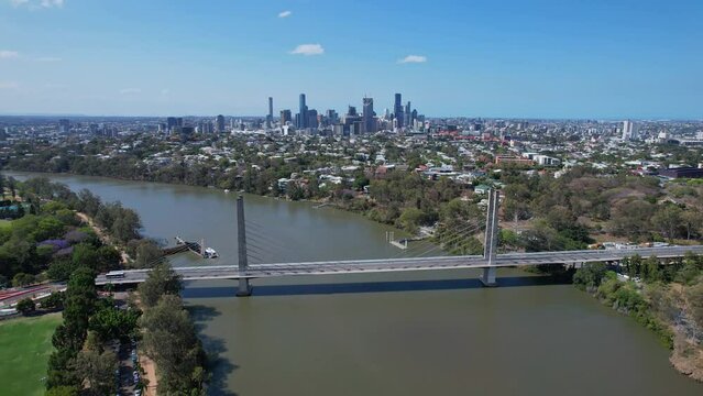 Eleanor Schonell Bridge Spanning Brisbane River, Backdropped By Brisbane Skyline. QLD, Australia. aerial pullback shot