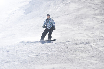 Man snowboarding in snowfield in Japan