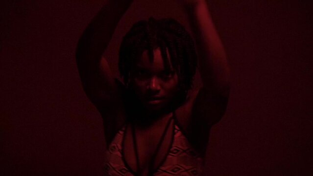 Slow motion of passionate powerful black woman dancing at studio