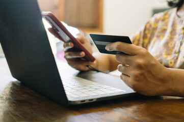 Electronic online financial payments through smartphone, card and laptop. Shotlistbanking