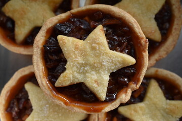 Freshly baked mince pie with star-shaped pie crust lid. 