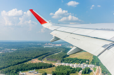 View from the airplane window during takeoff at Sheremetyevo airport at summer