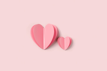 Two Pink paper hearts on pink colored background. Minimal style flat lay, pastel monochrome colors,...