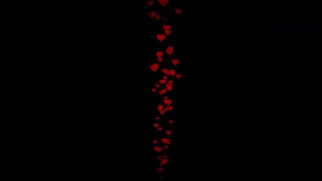 Part&iacute;cula con forma de coraz&oacute;n rojo con movimiento ascendente sobre fondo negro