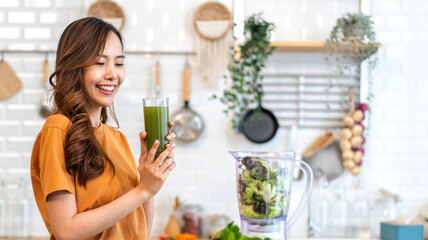 Portrait of beauty healthy asian woman making green vegetables detox cleanse and green fruit...