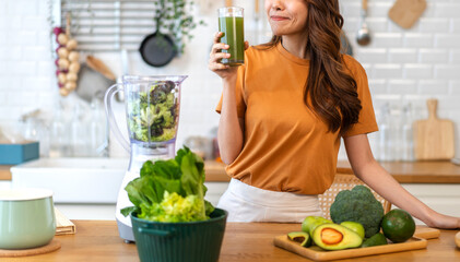 Portrait of beauty healthy asian woman making green vegetables detox cleanse and green fruit...