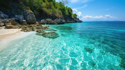 A secluded beach with crystal-clear water and white sand, untouched by tourism