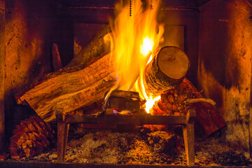 Fireplace in a log cabin during Christmas