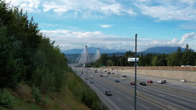 Port Mann Bridge. Vancouver, British Columbia, Canada, over Fraser River, connecting Surrey to Port Coquitlam. 4K Aerial video of the bridge with usual traffic.