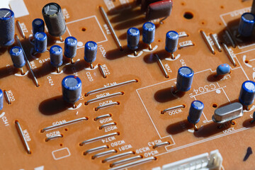 Printed circuit board with capacitors, close up photo
