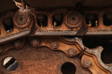 Close up photo of old rusted metal yellow tractor bulldozer. © igunawan.photo