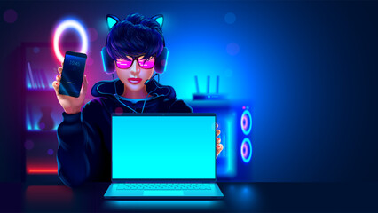 Blogger teenage girl is sitting at laptop in room with phone and headphones. Girl turned the laptop screen to viewer. Teenager in neon light with gaming laptop is on table. Computer vlogger streamer.