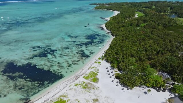 Aerial drone view of Ile Aux Cerfs, Flacq, Mauritius island, Indian Ocean. View of the white sanded beach in the tropical island. Summer holidays destination. Picturesque view of exotic landmark.