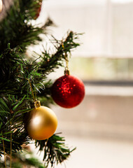 close-up christmas tree with red and golden color decorations with copy space