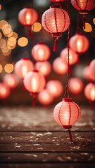 Chinese concept with an empty wood floor and red lantern decoration with a blurred glitter background.