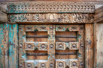 Old historical colorful doors and shutters made of wrought iron and wood. Old historical wooden doors in Cyprus. Doors and shutters of historical stone houses in Nicosia.