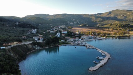 Aerial view of the tranquil sea and green hills with a town on the shore. Zakynthos, Keri